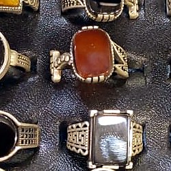 Men's ring with an oval orange carnelian aqeeq stone in an antique finish band
